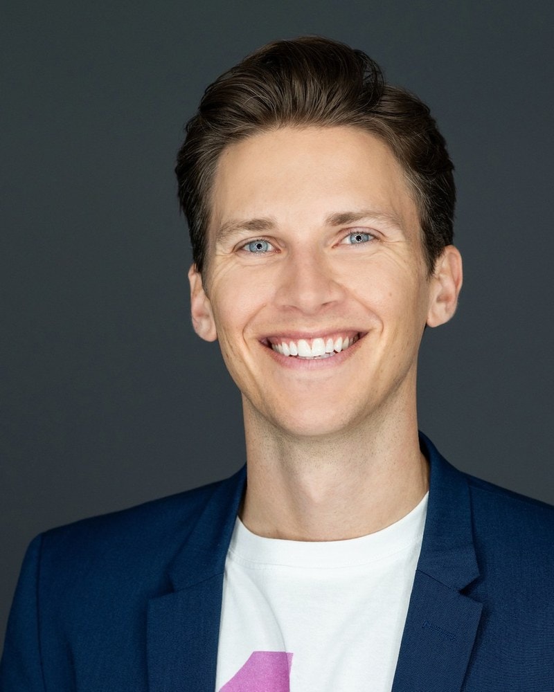 Chris Rollins, professional portrait in blue blazer